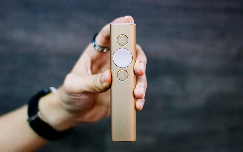 Logitech Spotlight presenter remote held in one hand